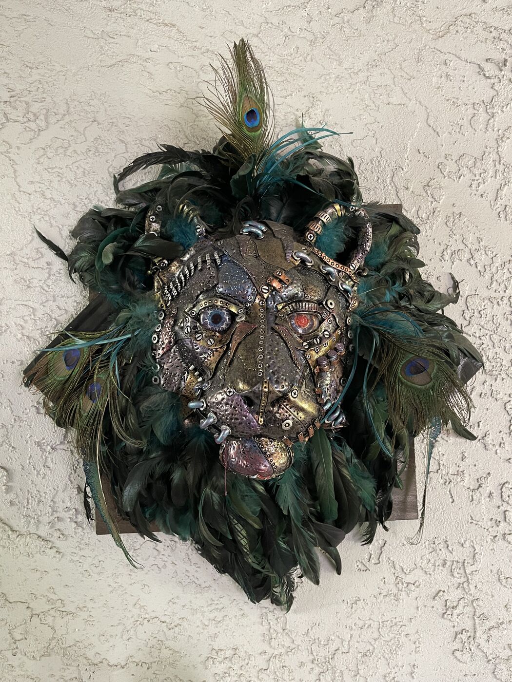 Sculpted steampunk animal-head wall mask by XZanthia — gears, metallic patina and a feather mane (piece 1 of 24)