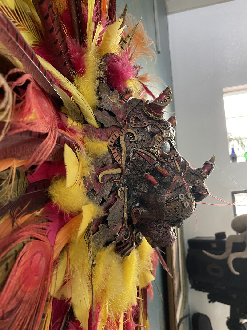 Sculpted steampunk animal-head wall mask by XZanthia — gears, metallic patina and a feather mane (piece 3 of 24)