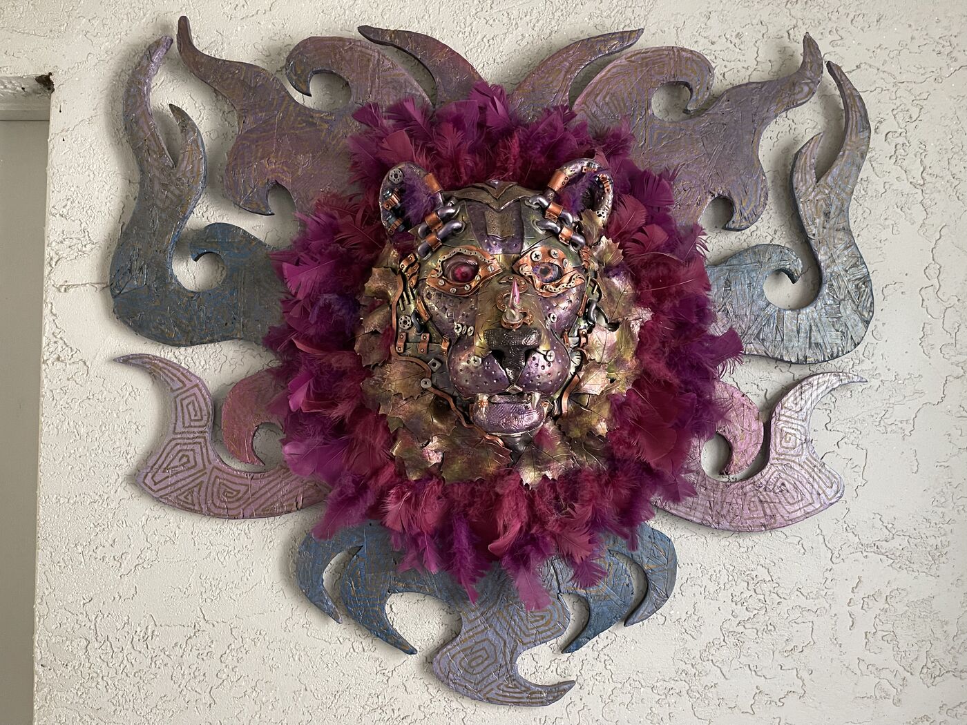 Sculpted steampunk animal-head wall mask by XZanthia — gears, metallic patina and a feather mane (piece 4 of 24)