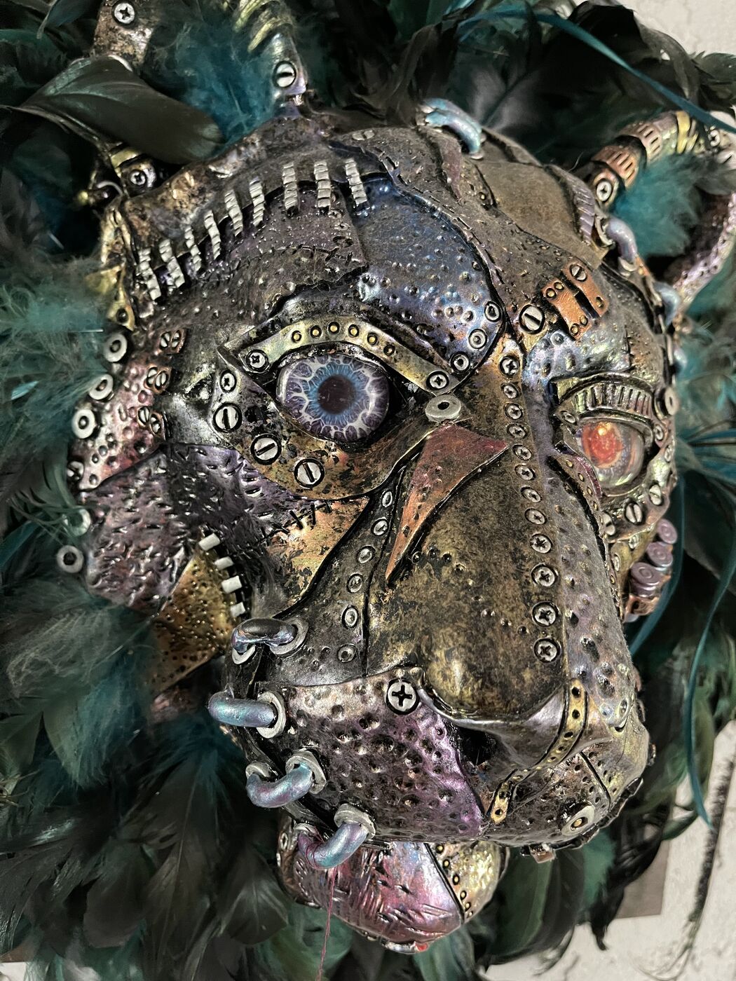 Sculpted steampunk animal-head wall mask by XZanthia — gears, metallic patina and a feather mane (piece 14 of 24)