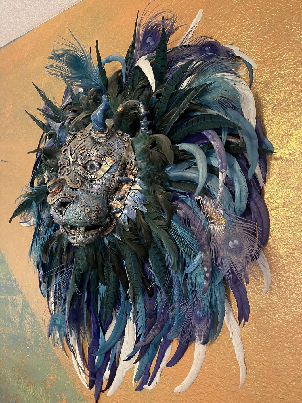 Sculpted steampunk animal-head wall mask by XZanthia — gears, metallic patina and a feather mane (piece 15 of 24)