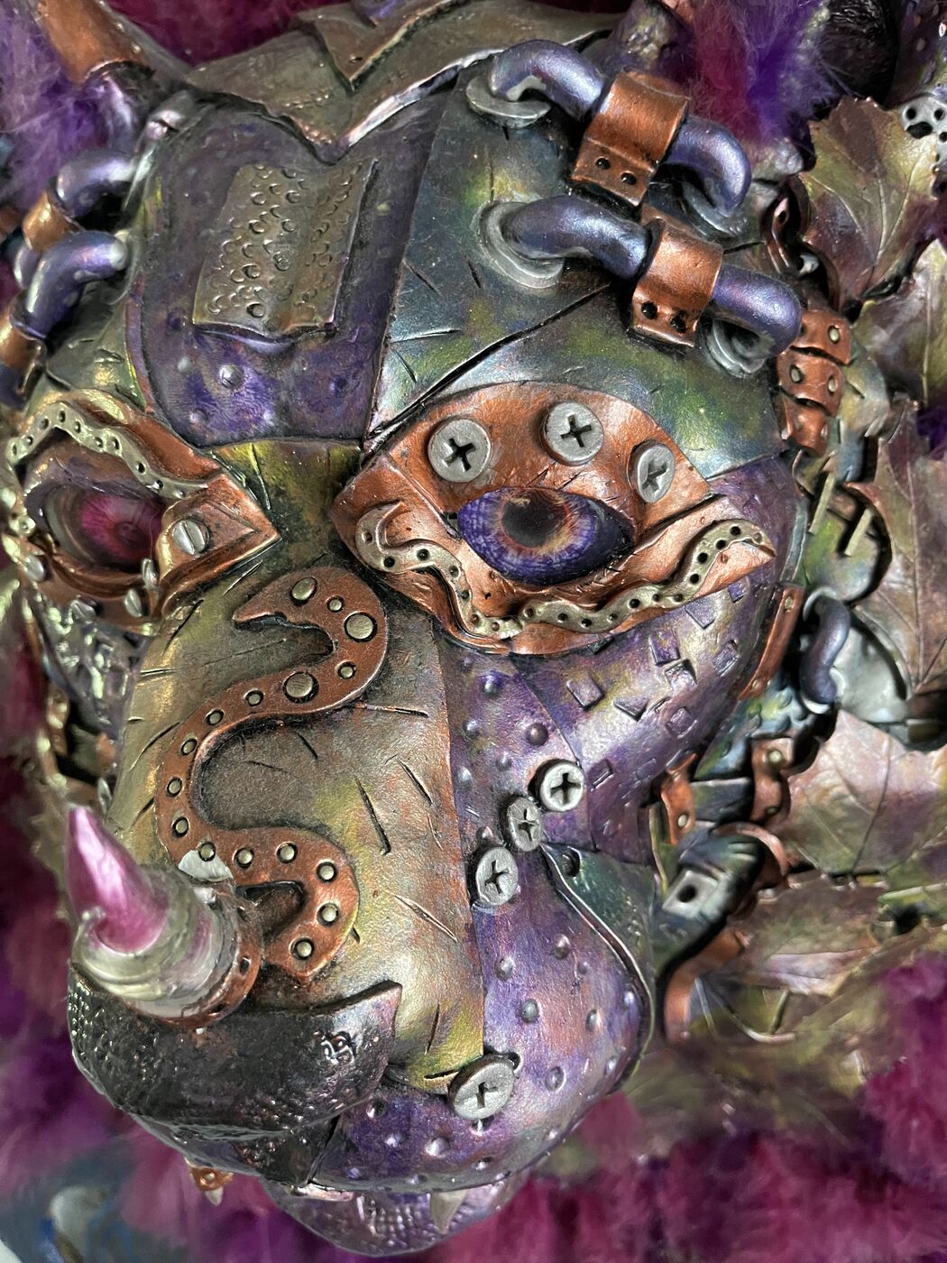 Sculpted steampunk animal-head wall mask by XZanthia — gears, metallic patina and a feather mane (piece 17 of 24)