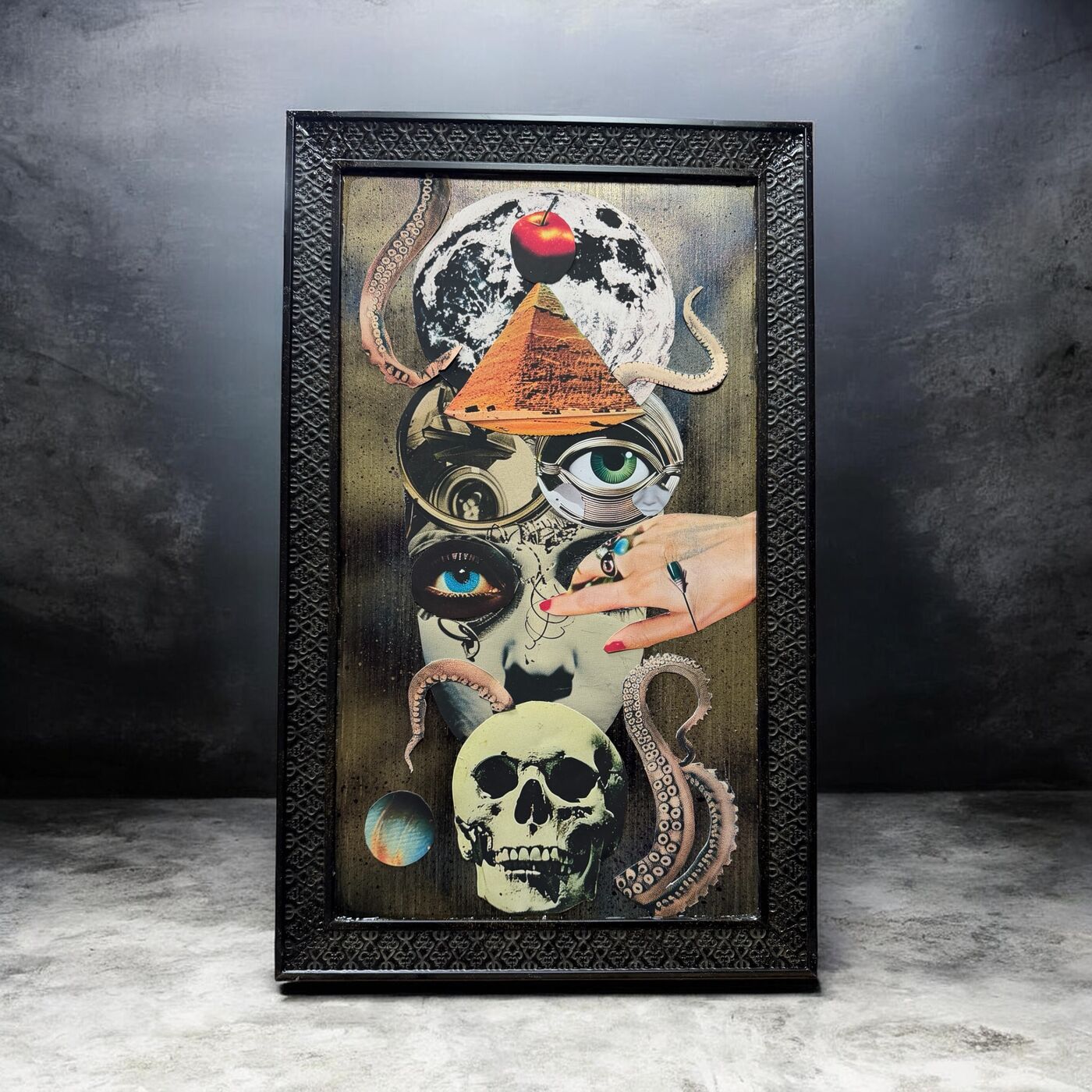 Framed dark mixed-media collage by XZanthia — skulls, eyes, clocks and floating islands (piece 1 of 9)