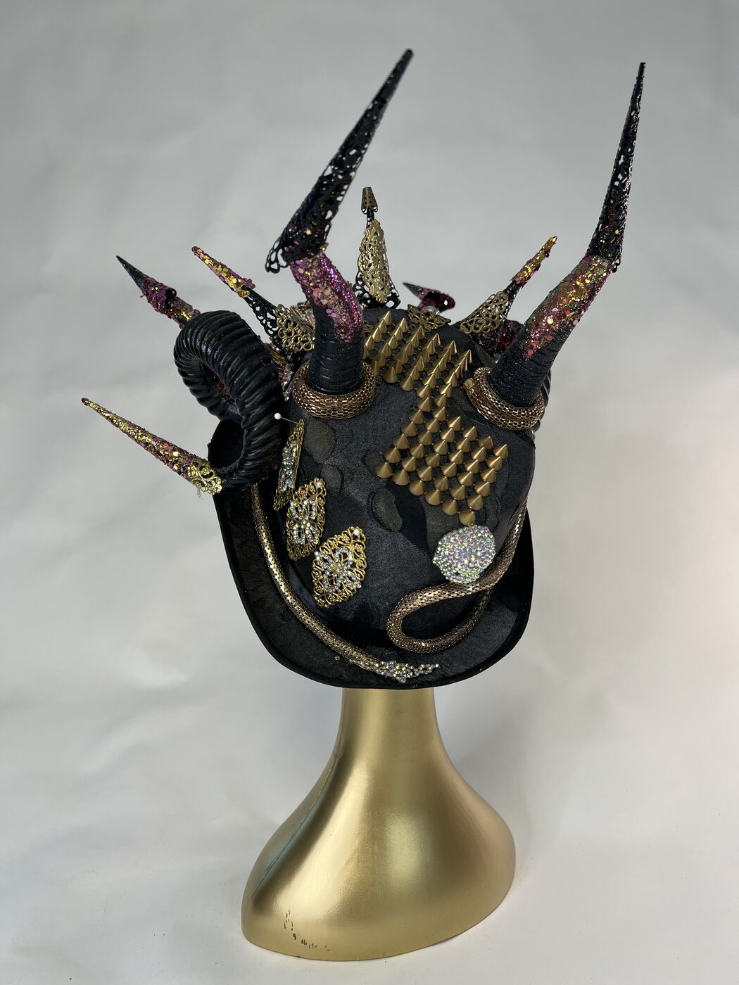 Handmade embellished top hat headpiece by XZanthia with horns and spikes, on a gold mannequin head (piece 3 of 15)
