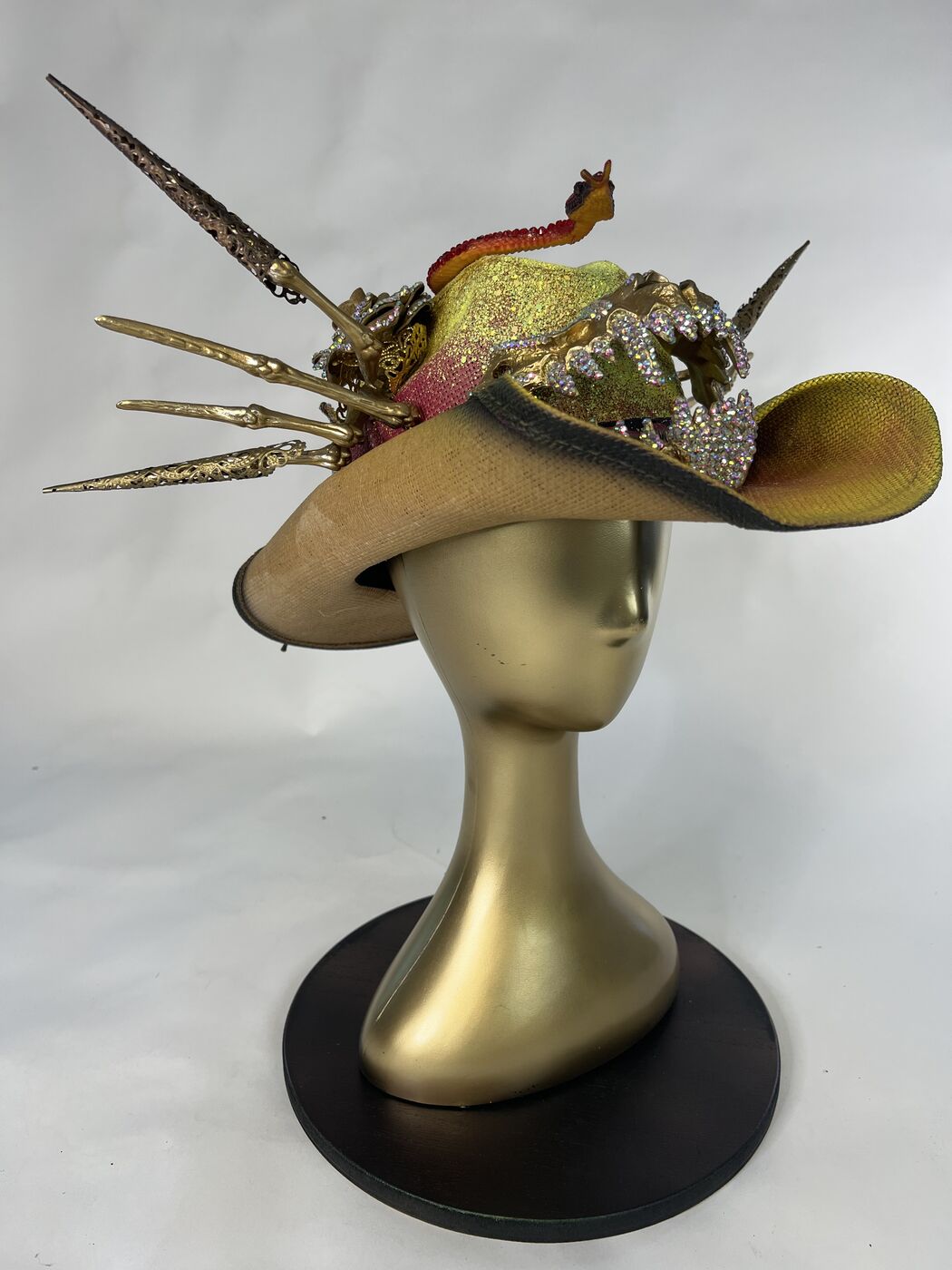 Handmade embellished top hat headpiece by XZanthia with horns and spikes, on a gold mannequin head (piece 11 of 15)